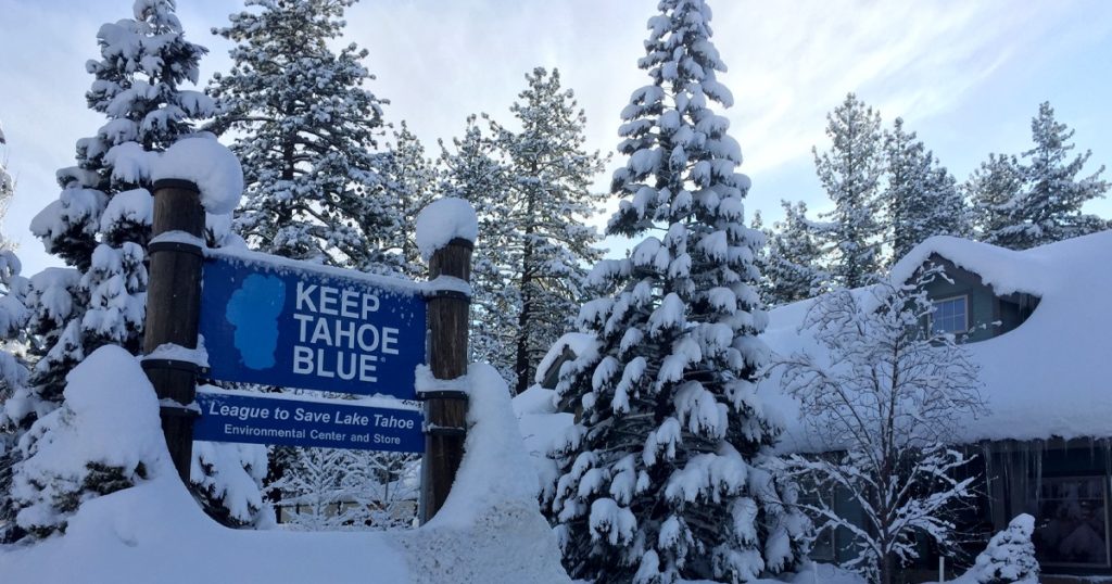 Keep Tahoe Blue Sign covered in snow