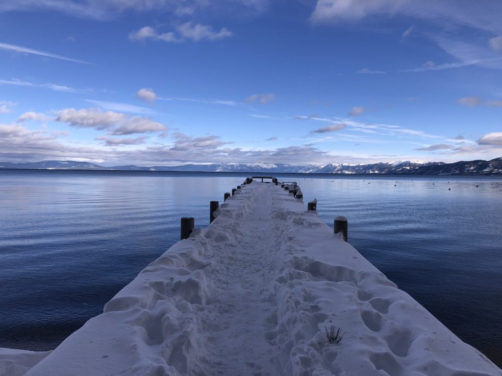 snow covered dock in lake tahoe